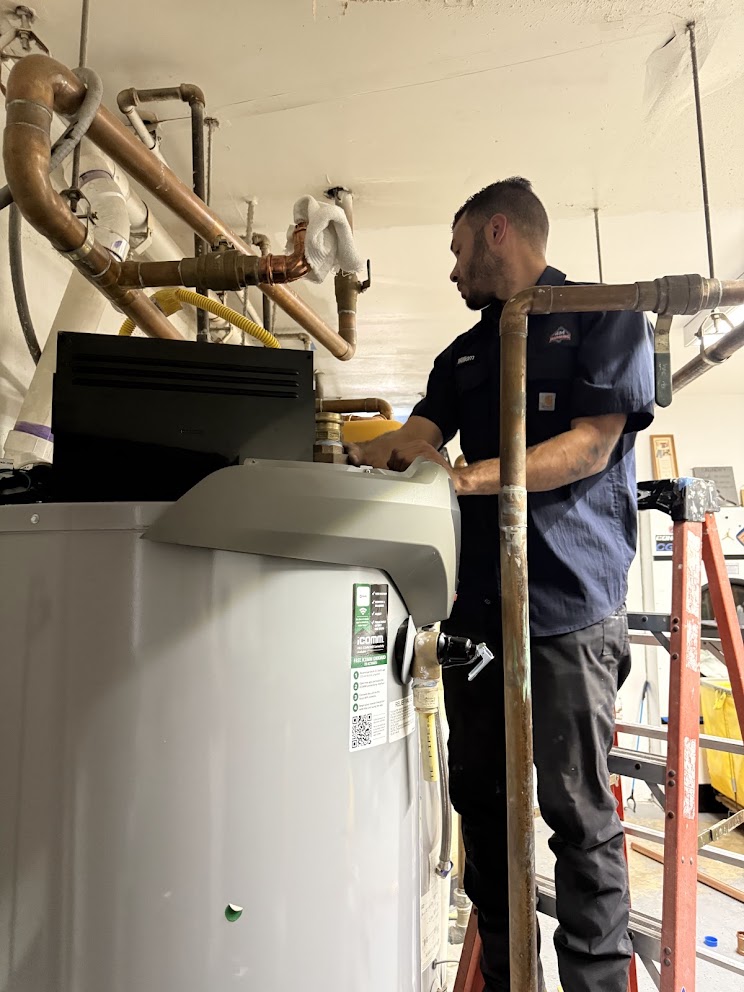 Man replacing a water heater in san antonio